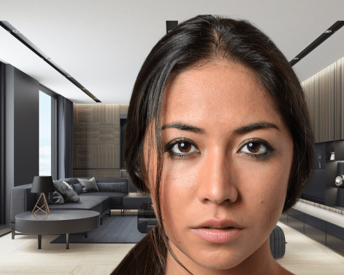 A young woman with a cold stare in the foreground of a picture. In the background is a mid-century contemporary seating area. This photo represents the title of the article, "Interpreting What's Behind Narcissist Eyes."